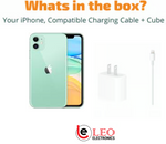 Green iPhone 11 , charging cable, and cube