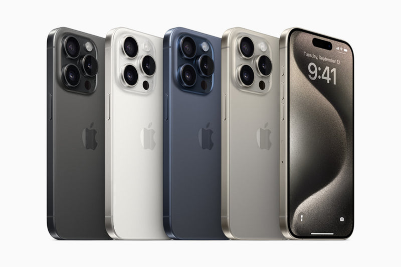 An array of iPhone 15 Pro Max smartphones in various colors aligned in a row.