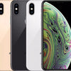 Three iPhone XS smartphones in gold, silver, and gray colors, displayed horizontally with the screen of the gold phone facing front showing the wallpaper.