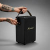 ​"Marshall Tufton portable speaker with a rugged build, textured black finish, and gold-tone control knobs on the top panel."